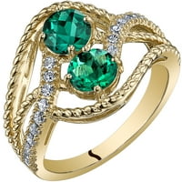 Oravo ct okrugli oblik stvorio je smaragdni prsten s dva kamena u 14K žutom zlatu
